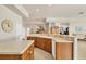 Spacious kitchen with a breakfast bar, tile floors, and open layout leading to dining and living areas at 16 Windward Ter, Placida, FL 33946