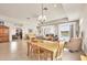 Inviting living room with tile floors, a view of the pool, and an open layout great for gatherings at 16 Windward Ter, Placida, FL 33946