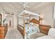 Comfortable bedroom featuring a four poster bed, soft lighting, and neutral decor at 16 Windward Ter, Placida, FL 33946