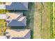 Aerial view of rooftops and neatly arranged backyards and green spaces at 1602 Saddlewood Cir, Port Charlotte, FL 33953