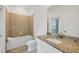 Well-lit bathroom featuring granite countertops and tiled shower-tub combo at 1602 Saddlewood Cir, Port Charlotte, FL 33953