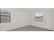 Bedroom with two windows, light colored walls, and tiled floor at 1602 Saddlewood Cir, Port Charlotte, FL 33953