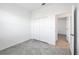 Bright bedroom with closet and light gray tile floors at 1602 Saddlewood Cir, Port Charlotte, FL 33953