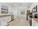 Well-lit kitchen features stainless steel appliances, granite countertops, and sleek white cabinetry at 1602 Saddlewood Cir, Port Charlotte, FL 33953