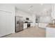 Open kitchen with stainless steel appliances, granite countertops, and a pantry at 1602 Saddlewood Cir, Port Charlotte, FL 33953