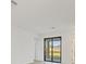 Bright living room featuring neutral walls, tile floors, and a large window at 1602 Saddlewood Cir, Port Charlotte, FL 33953