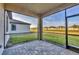 Screened patio with brick flooring and a view of the backyard at 1602 Saddlewood Cir, Port Charlotte, FL 33953