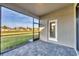 Screened-in patio with brick flooring and backyard access at 1602 Saddlewood Cir, Port Charlotte, FL 33953