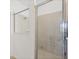 Glass-enclosed tiled shower with chrome hardware at 1602 Saddlewood Cir, Port Charlotte, FL 33953