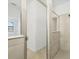 Bright bathroom features a glass-enclosed tiled shower at 1602 Saddlewood Cir, Port Charlotte, FL 33953