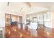 Elegant dining room with hardwood floors, modern chandelier, and seating for six at 16250 Sunset Pines Cir, Boca Grande, FL 33921