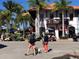 White building with a red tile roof with people out front at 16250 Sunset Pines Cir, Boca Grande, FL 33921