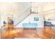 Bright foyer with hardwood floors, modern staircase, and stylish decor at 16250 Sunset Pines Cir, Boca Grande, FL 33921