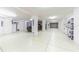 Spacious and brightly lit garage with epoxy floors and ample storage space at 16250 Sunset Pines Cir, Boca Grande, FL 33921