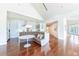 Cozy kitchen nook with custom banquette seating, white cabinets, and hardwood floors at 16250 Sunset Pines Cir, Boca Grande, FL 33921