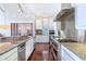 Well-appointed kitchen featuring stainless steel appliances and granite countertops at 16250 Sunset Pines Cir, Boca Grande, FL 33921