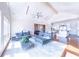 Open-concept living area with hardwood floors seamlessly connecting to the kitchen and dining space at 16250 Sunset Pines Cir, Boca Grande, FL 33921