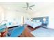 Spacious main bedroom featuring hardwood floors, a sitting area, and stylish decor at 16250 Sunset Pines Cir, Boca Grande, FL 33921