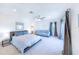 Main bedroom with fan, sitting area, king bed and lots of natural light at 16250 Sunset Pines Cir, Boca Grande, FL 33921