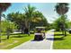 Street view with golf cart at 16250 Sunset Pines Cir, Boca Grande, FL 33921