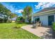Picturesque backyard featuring a cozy patio, beautiful landscaping, and a serene ambiance at 17 Dominica Dr, Englewood, FL 34223