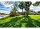 Spacious backyard with beautiful landscaping, featuring a screened-in lanai for comfortable outdoor living at 17 Dominica Dr, Englewood, FL 34223