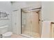Bright bathroom featuring a glass shower with tile surround and modern fixtures at 17 Dominica Dr, Englewood, FL 34223