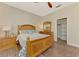 Bedroom showcasing hardwood floors, a ceiling fan, a closet, and natural light at 17 Dominica Dr, Englewood, FL 34223