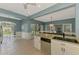 Charming kitchen with an open floor plan, granite counters, stainless steel appliances, and recessed lights at 17 Dominica Dr, Englewood, FL 34223