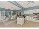 Open-concept kitchen with dining area featuring granite countertops, stainless steel appliances, and modern finishes at 17 Dominica Dr, Englewood, FL 34223