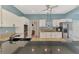 Spacious kitchen with white cabinets, granite countertops, and stainless steel appliances at 17 Dominica Dr, Englewood, FL 34223