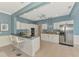 Kitchen with breakfast bar, stainless steel appliances, and granite countertops at 17 Dominica Dr, Englewood, FL 34223