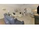 Bright living room with light gray walls, white sofa, and stylish decorations at 17 Dominica Dr, Englewood, FL 34223