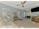 Inviting living room that extends to the outdoor screened-in lanai and pool area at 17 Dominica Dr, Englewood, FL 34223
