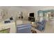 Bright living room with view to dining room, kitchen and front door entry at 17 Dominica Dr, Englewood, FL 34223