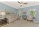 Bright living room featuring modern furnishings, a ceiling fan, and serene wall art at 17 Dominica Dr, Englewood, FL 34223