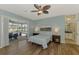 Comfortable main bedroom with sliding glass doors that lead to the outdoor living area and pool at 17 Dominica Dr, Englewood, FL 34223