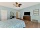 Bright main bedroom featuring a ceiling fan and views to an outdoor living space at 17 Dominica Dr, Englewood, FL 34223