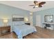 Well-lit main bedroom featuring hard surface floors, soft blue walls, and a comfortable layout at 17 Dominica Dr, Englewood, FL 34223
