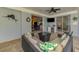 Cozy screened patio with comfortable wicker seating and convenient access to indoor living spaces at 17 Dominica Dr, Englewood, FL 34223