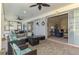 Relaxing screened patio with stylish wicker furniture and decor, leading to the interior of the house at 17 Dominica Dr, Englewood, FL 34223