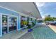 Inviting storefront with bright blue facade, open doors, and eye-catching displays for a welcoming retail experience at 17 Dominica Dr, Englewood, FL 34223
