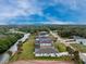 Aerial view of waterfront property with canal access, lush landscaping, and ample outdoor space at 184 Eppinger Dr, Port Charlotte, FL 33953