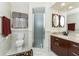 Bathroom features a toilet, glass enclosed shower, and granite-topped vanity at 184 Eppinger Dr, Port Charlotte, FL 33953