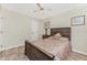 Bedroom features a wood bed frame, tile flooring, and ample natural light at 184 Eppinger Dr, Port Charlotte, FL 33953