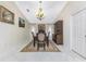 Elegant dining room featuring traditional furnishings, chandelier lighting, and neutral decor at 184 Eppinger Dr, Port Charlotte, FL 33953