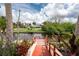 Dock with well-manicured landscaping offering seamless water access and scenic views at 184 Eppinger Dr, Port Charlotte, FL 33953