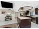 Modern kitchen with stainless steel appliances, large island, and sleek dark wood cabinets at 184 Eppinger Dr, Port Charlotte, FL 33953