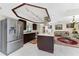Kitchen featuring stainless steel refrigerator, dark wood cabinets, white counters, and a center island at 184 Eppinger Dr, Port Charlotte, FL 33953