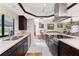 A spacious kitchen featuring dark cabinets, white countertops and stainless steel appliances at 184 Eppinger Dr, Port Charlotte, FL 33953